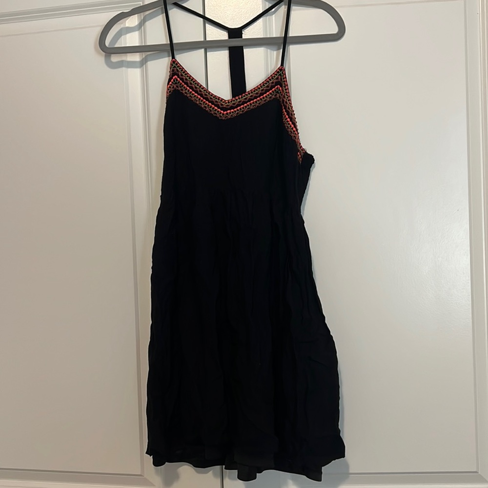 francesca’s black dress with detailing